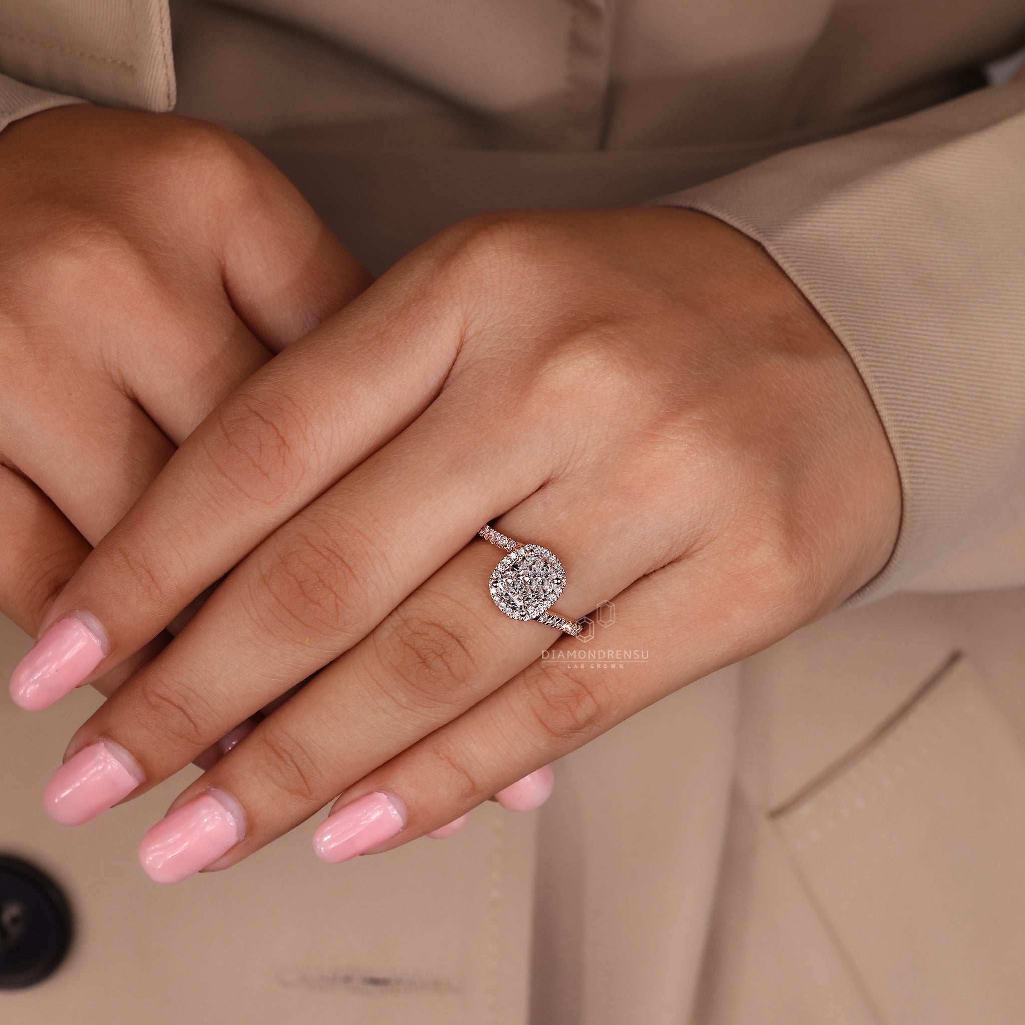 Rose gold ring with cushion cut and pave accents.
