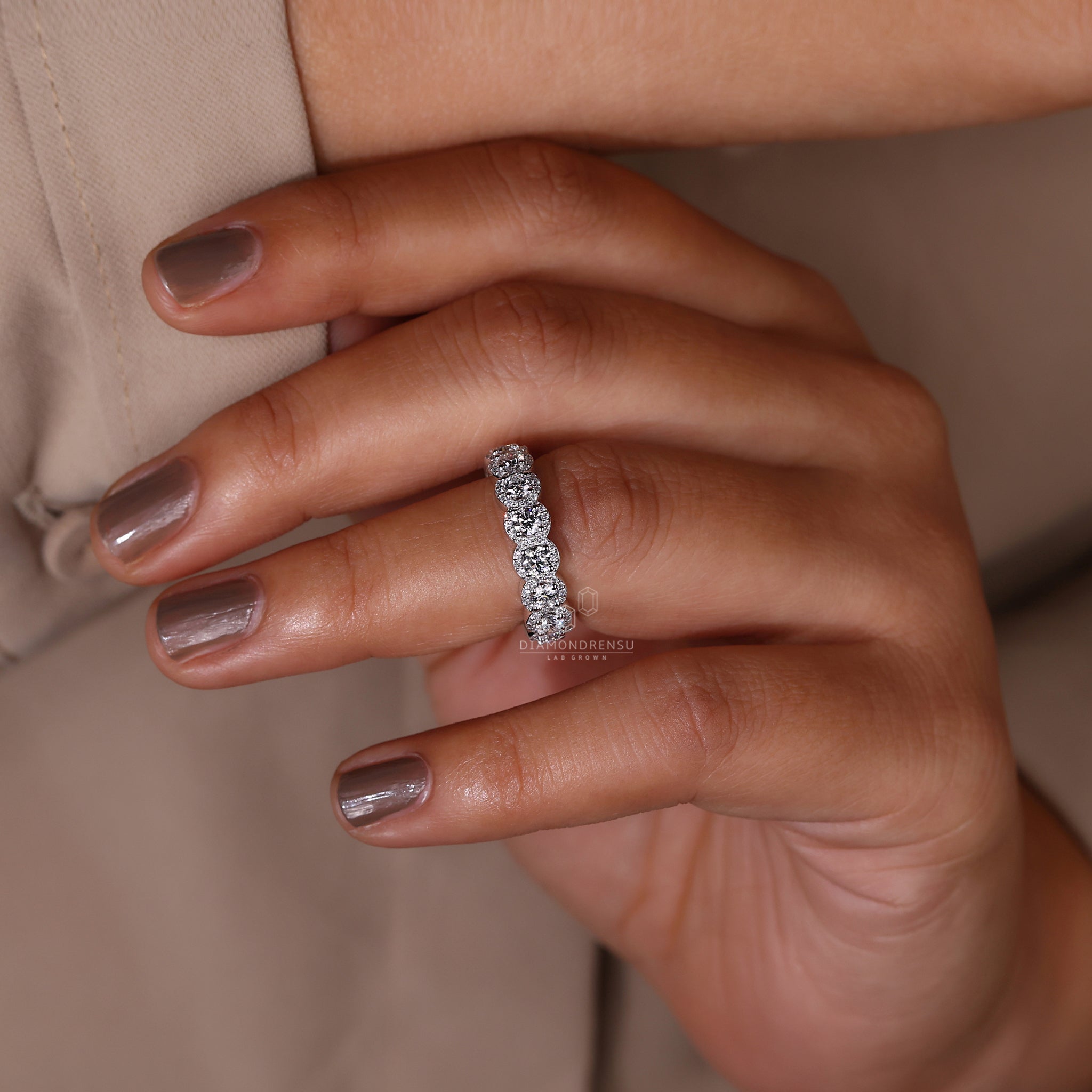 Elegant white gold wedding band with halo diamond setting
