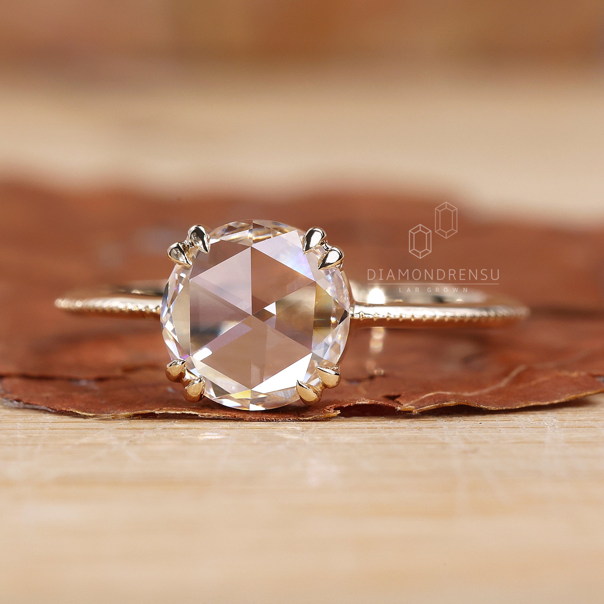 Proposal engagement ring with hart shape prong set and simple solitaire style.
