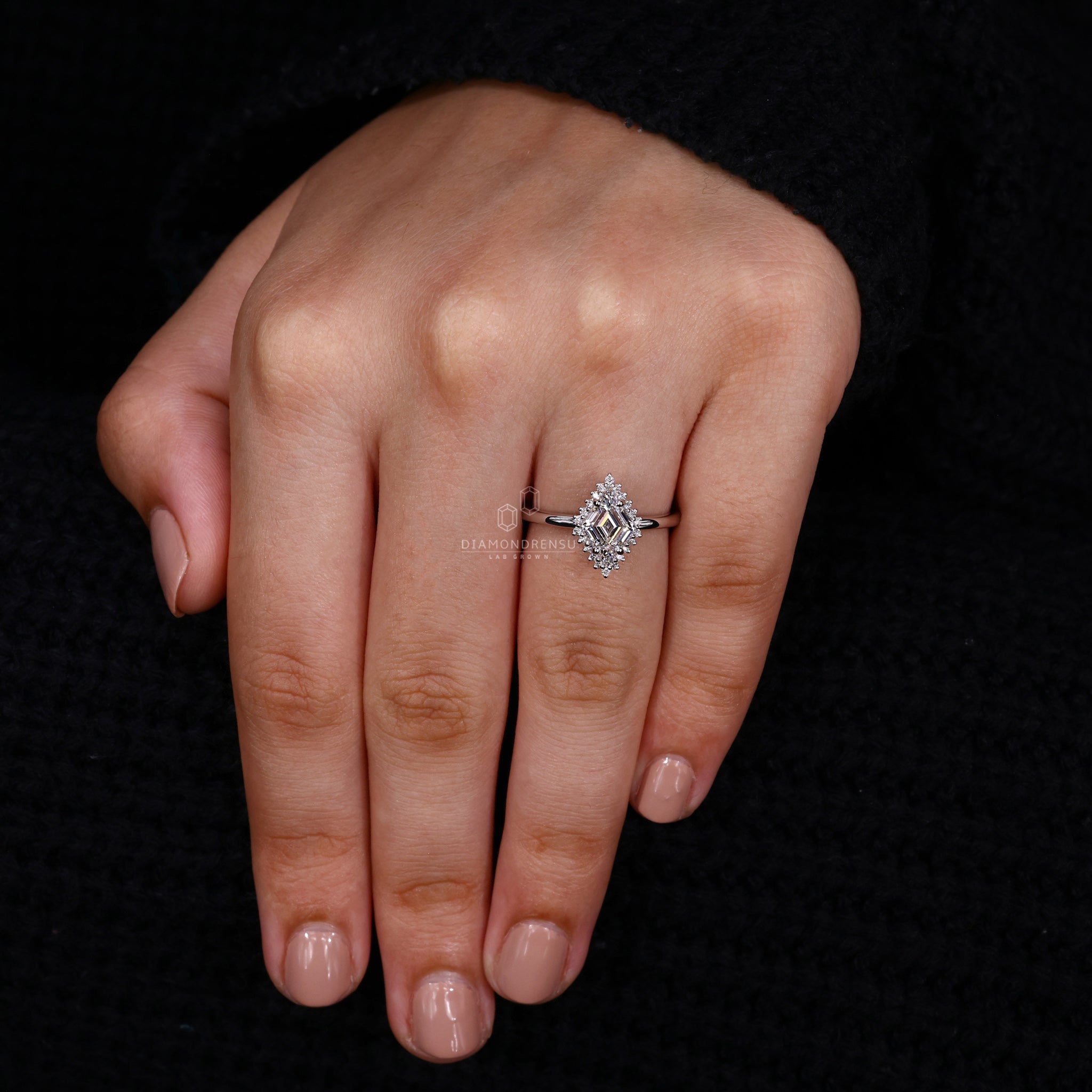 Lab diamond ring featuring halo diamond setting and four prong set.
