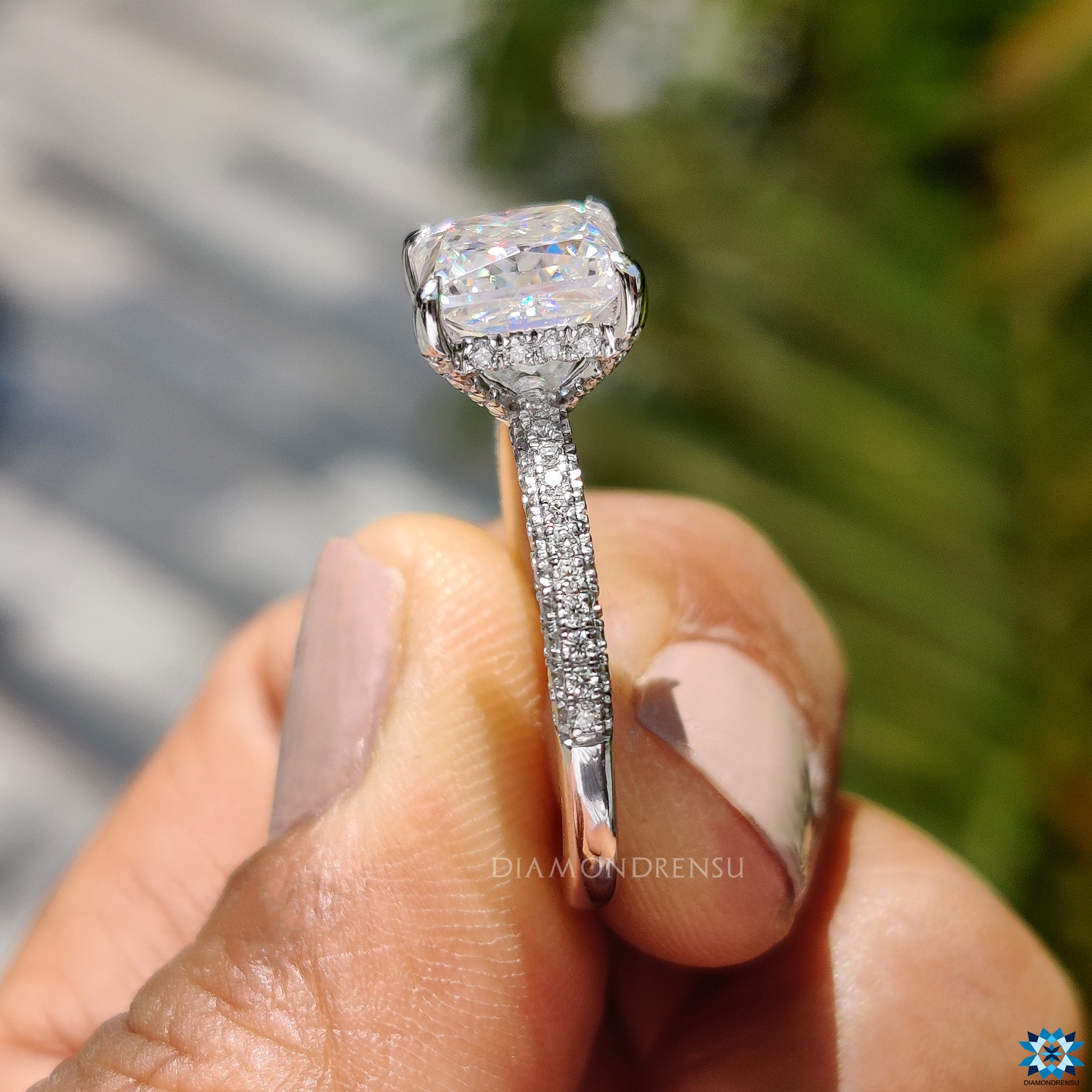 Round cut pave band with hidden halo and princess moissanite centre.
