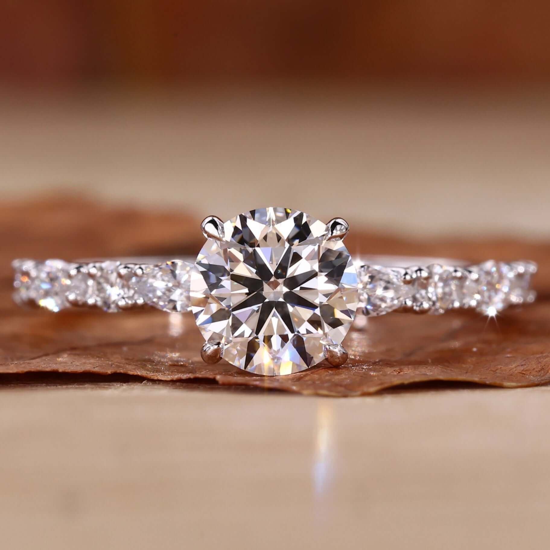 Elegant hidden halo ring showcasing a sparkling centre diamond.