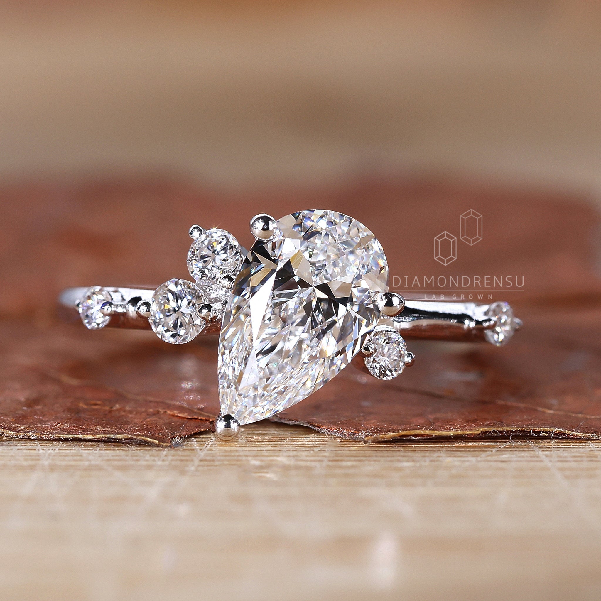 Prong setting ring featuring a dazzling pear diamond.