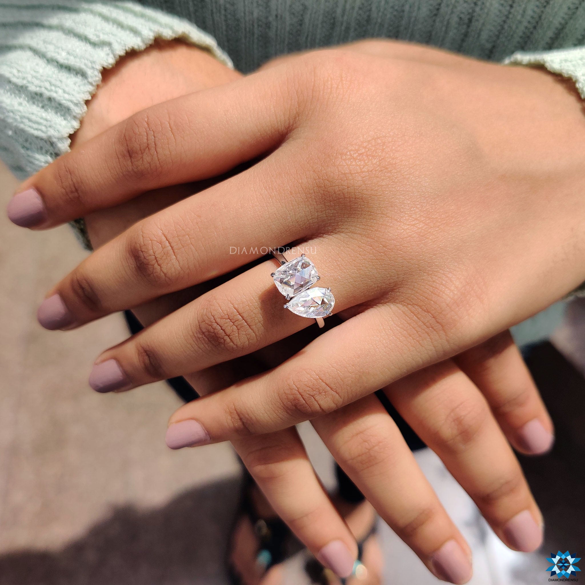 Pear and cushion rose cut moissanite ring in white gold.
