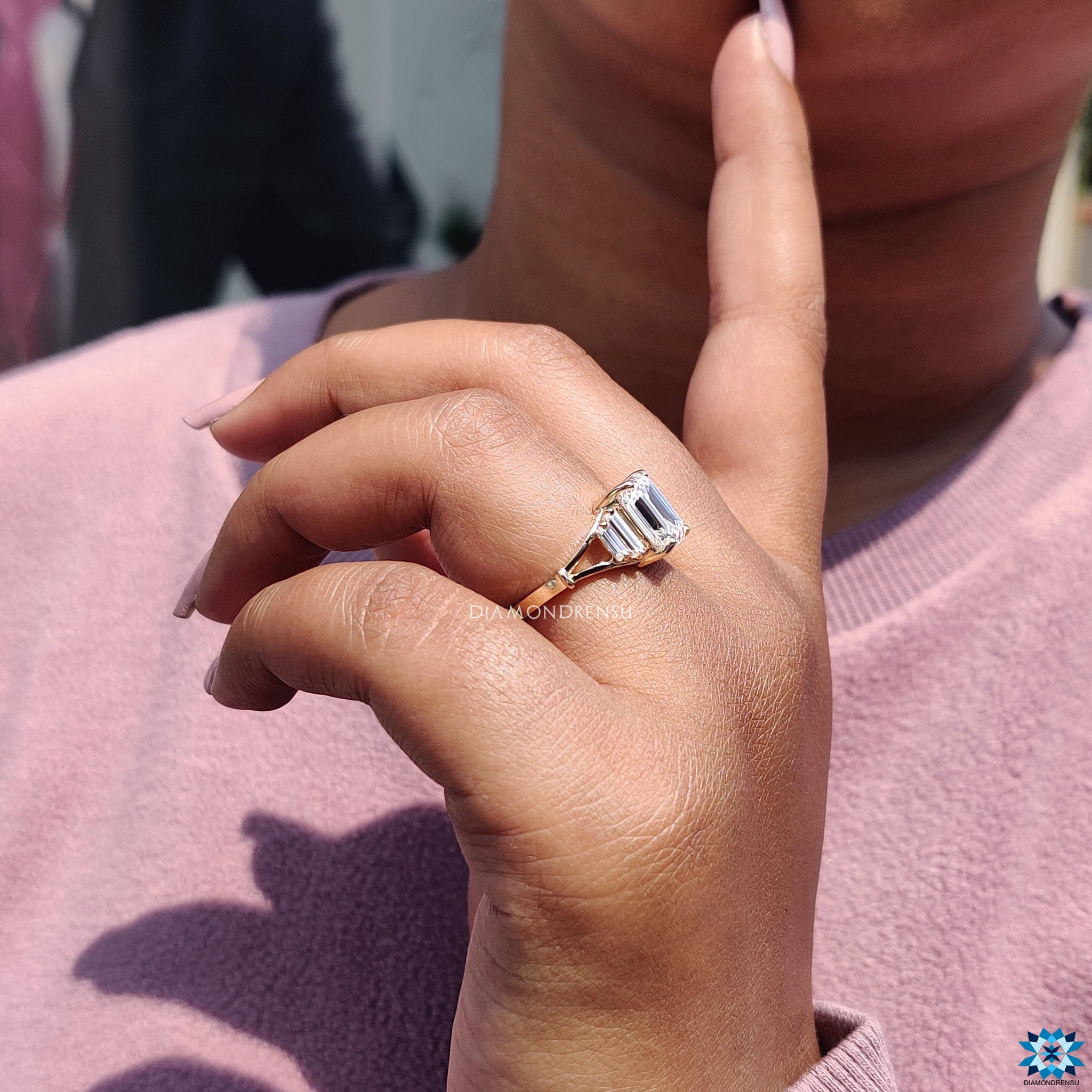 Handmade yellow gold ring with emerald cut center.
