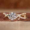 Twisted engagement ring in yellow gold.
