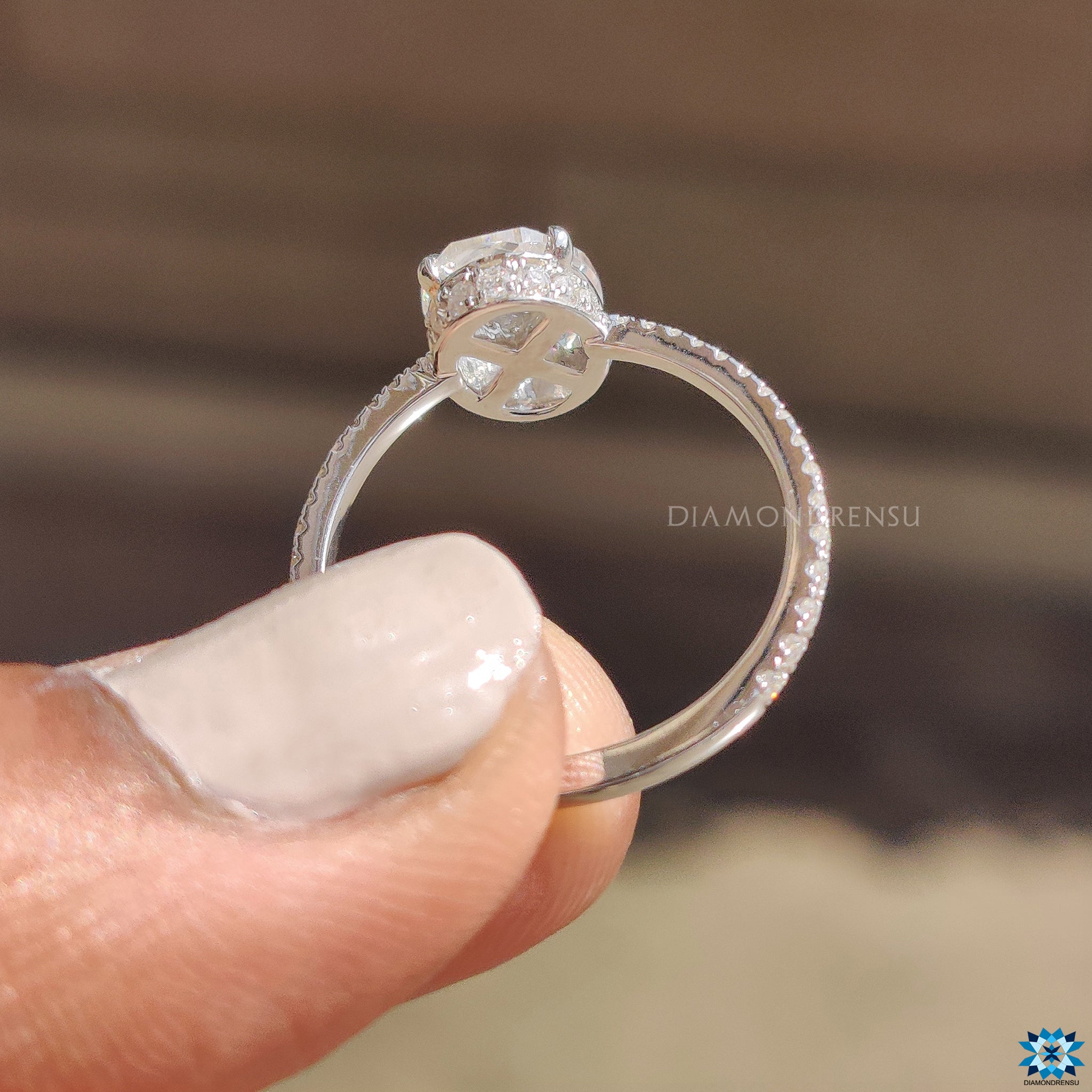 Moissanite for engagement ring with oval rose cut and round hidden halo.
