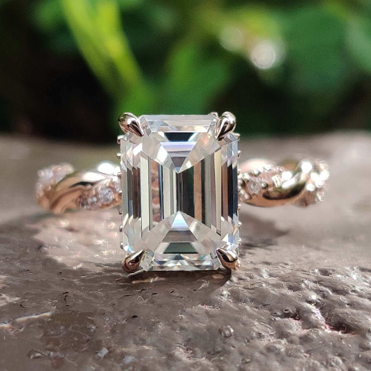 Emerald cut engagement ring with under halo design.
