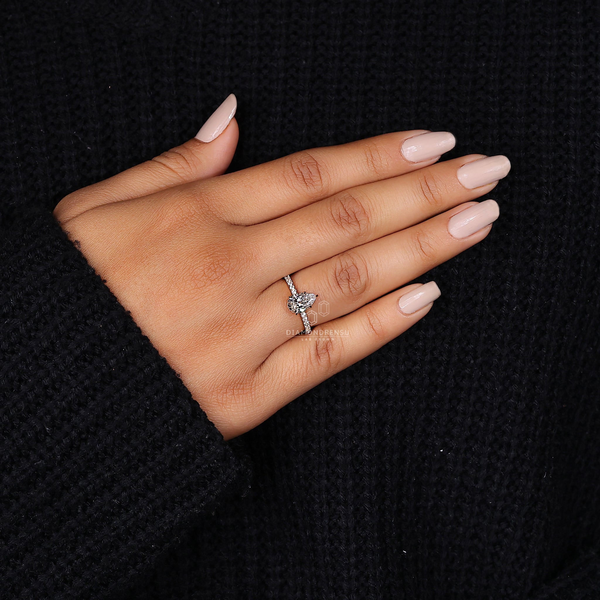 Round cut hidden halo engagement ring in yellow gold style.
