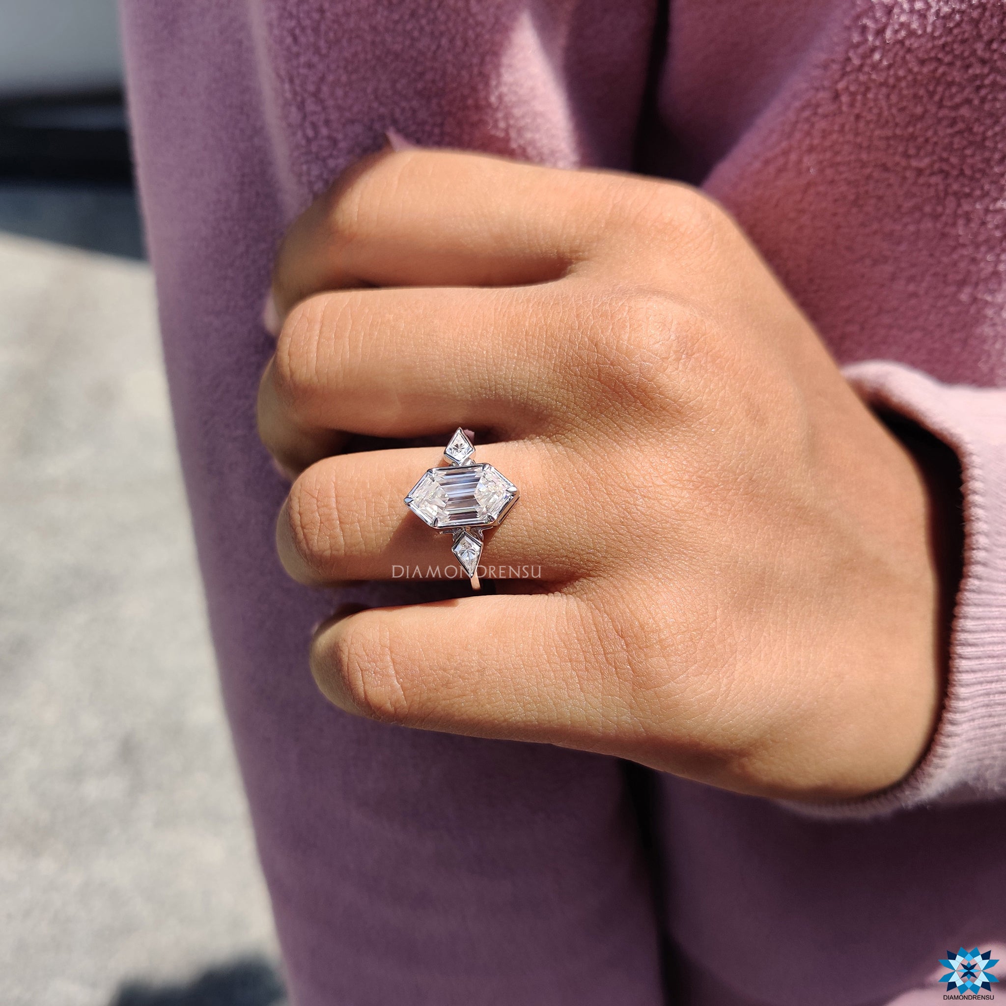 Kite cut engagement ring featuring hexagon centre in sleek bezel setting.
