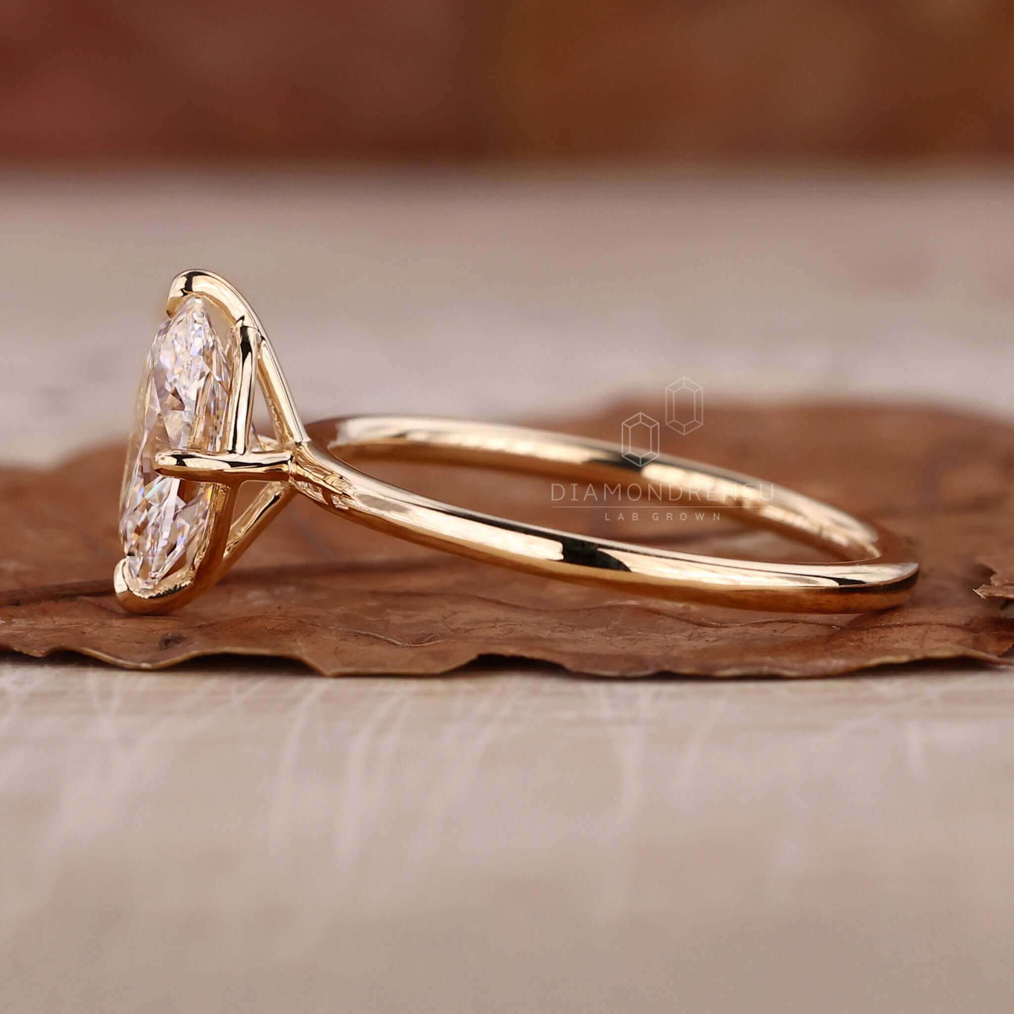 Oval solitaire engagement ring in a classic claw prong setting.