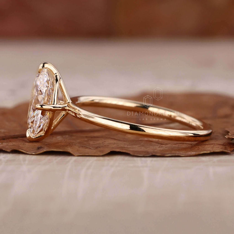 Oval solitaire engagement ring in a classic claw prong setting.