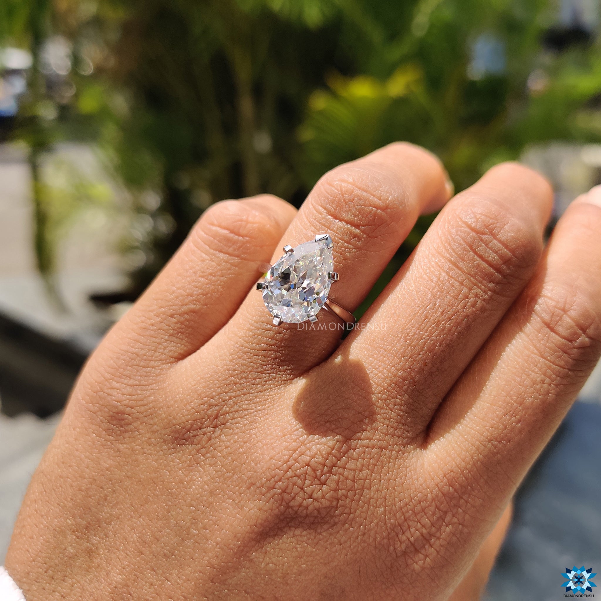 Handmade jewelry with 5.17 carat pear Rensu cut moissanite in a solitaire ring.

