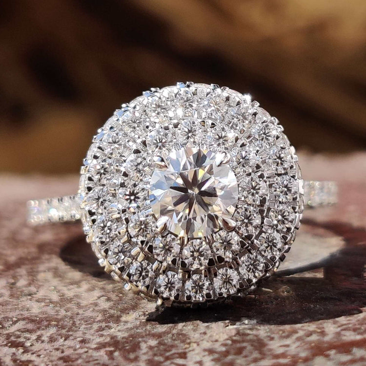 Double halo engagement ring with round cut moissanite.
