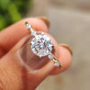1 carat engagement ring with round cut moissanite in yellow gold band.
