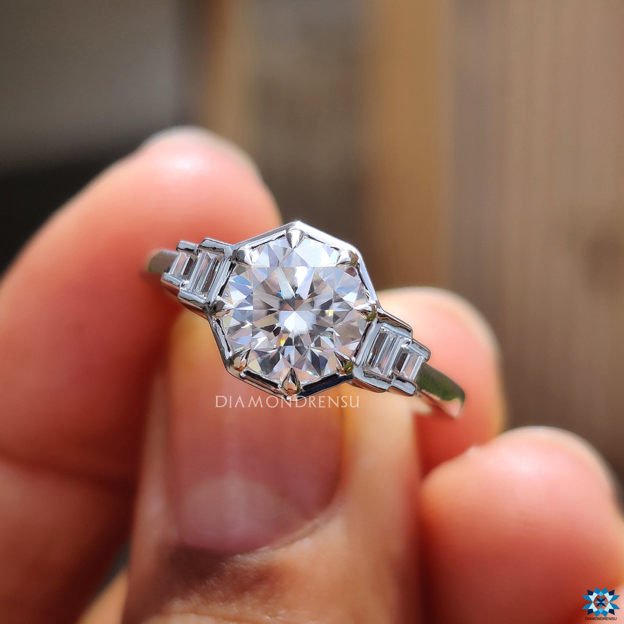 Handmade ring in white gold with five moissanite stones in prong settings.
