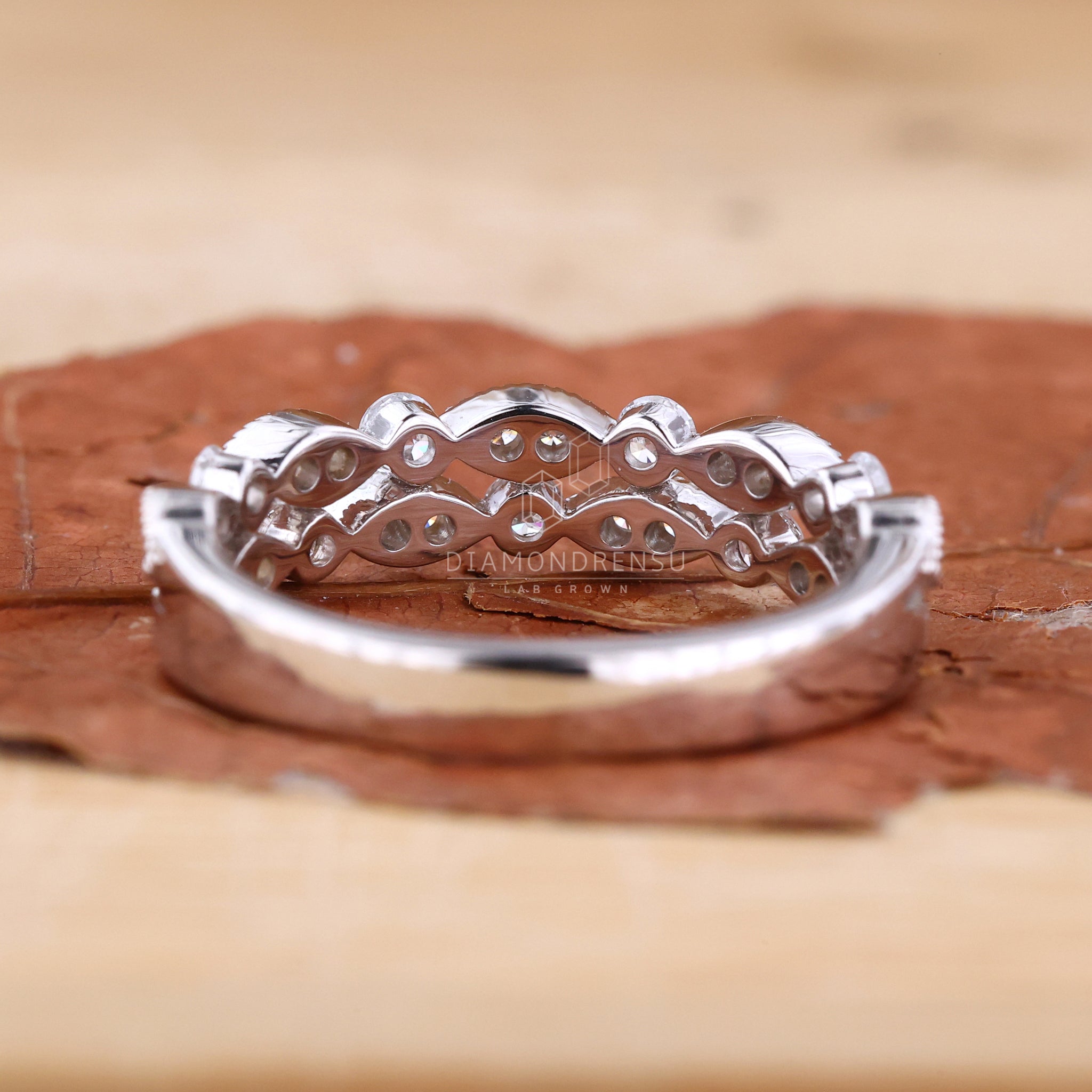 Classic white gold eternity wedding ring with fine detailing
