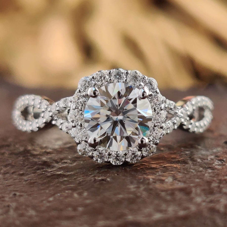Twisted pave engagement ring with round cut moissanite.
