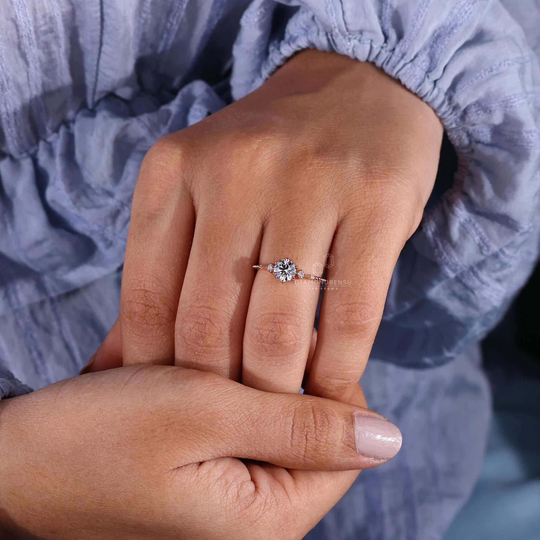 Round cut diamond ring featuring handmade jewellery, ideal for a unique engagement ring that combines tradition and modernity.
