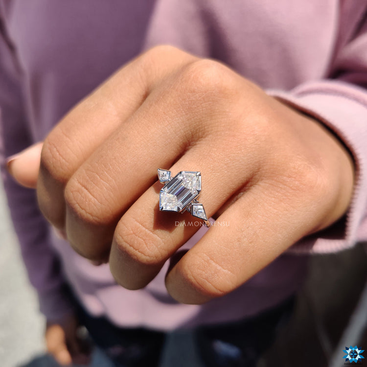 Diamondrensu UK engagement ring with hexagon bezel and kite accents.

