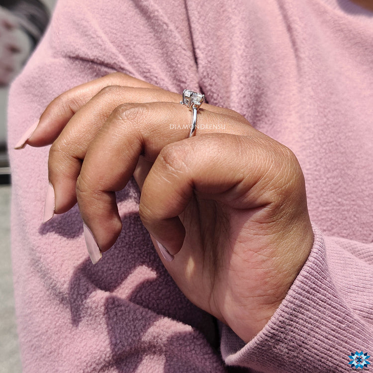 Elegant white gold hexagon engagement ring with custom moissanite design.
