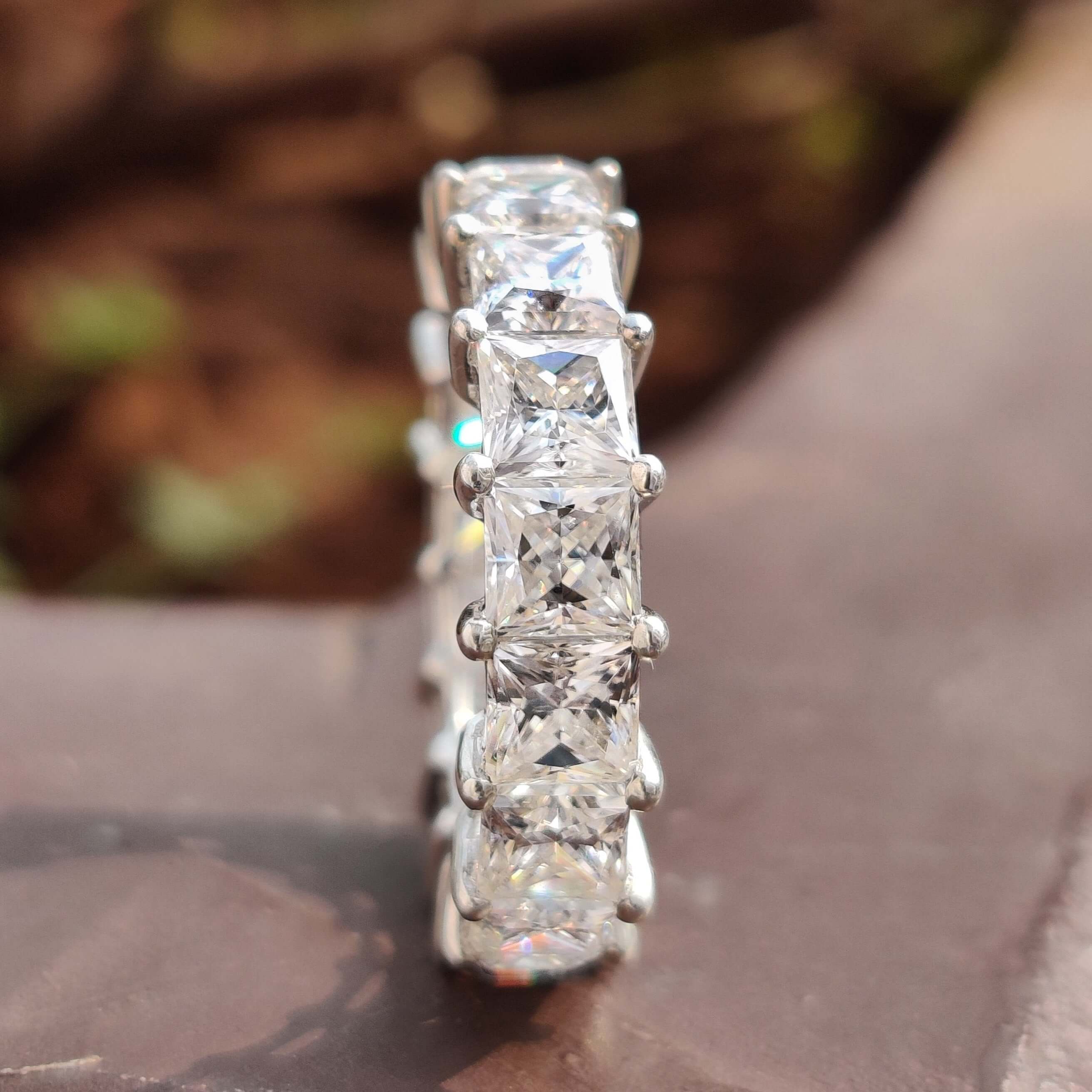 Elegant princess cut band crafted with colorless moissanite for a 
brilliant and timeless look.