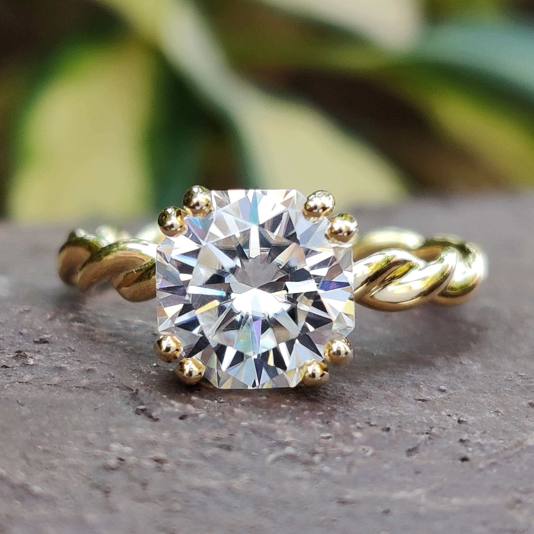 Close-up view of a beautiful octagon engagement ring with intricate details and a sparkling center stone.
