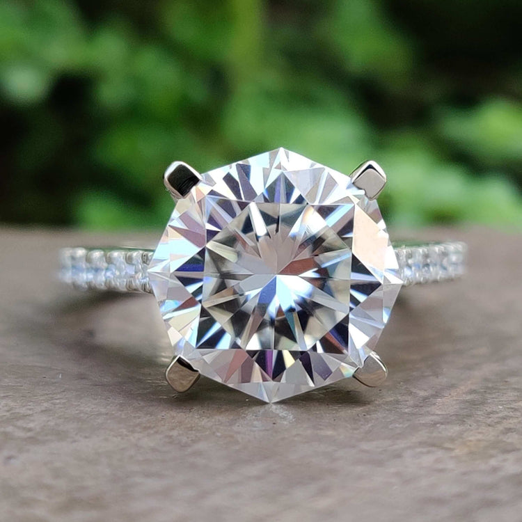 Octagon cut moissanite engagement ring in white gold.
