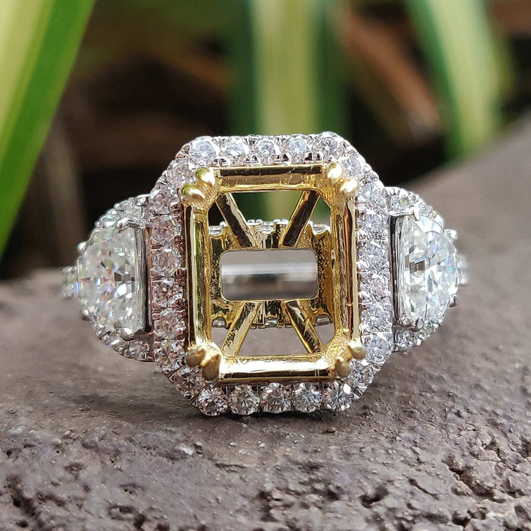 Semi mount engagement ring with three stone moissanite design.
