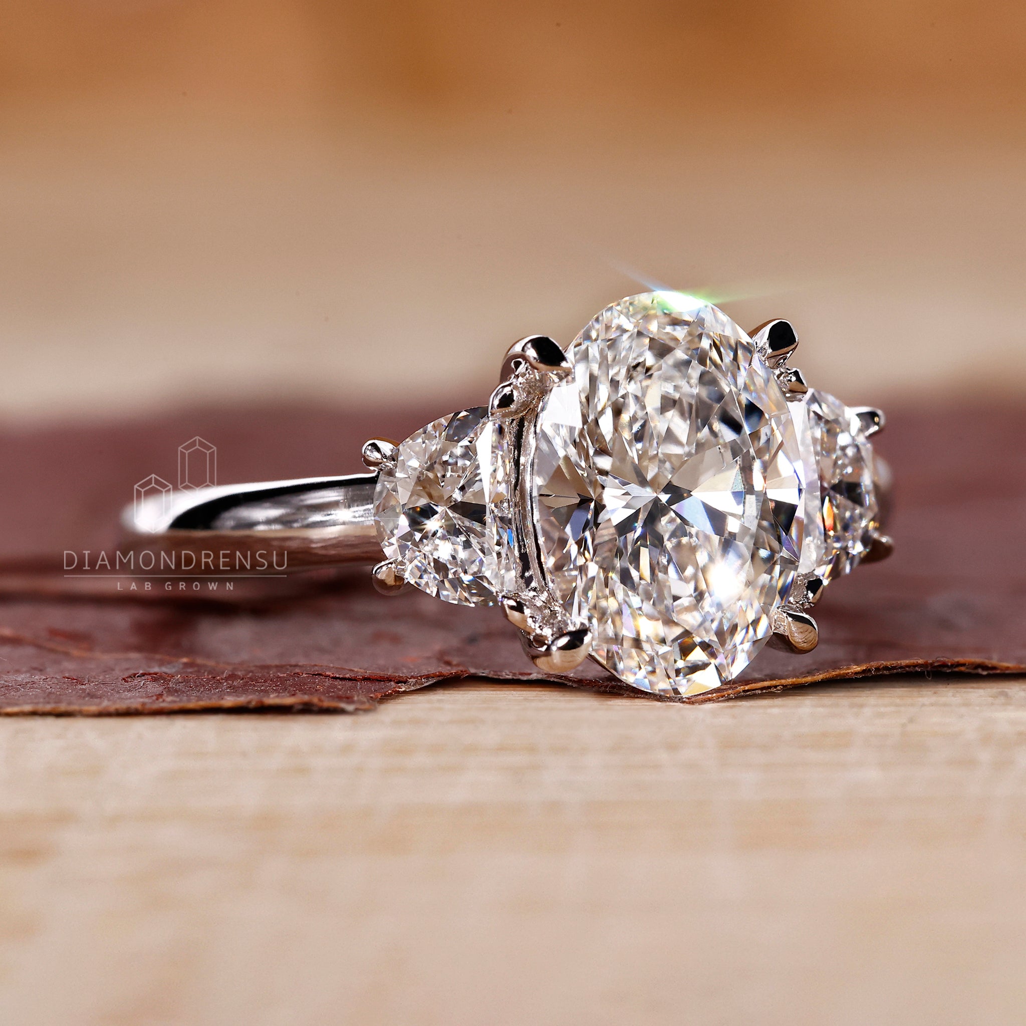 Handmade 3 stone ring by Diamondrensu UK with lab grown diamonds.
