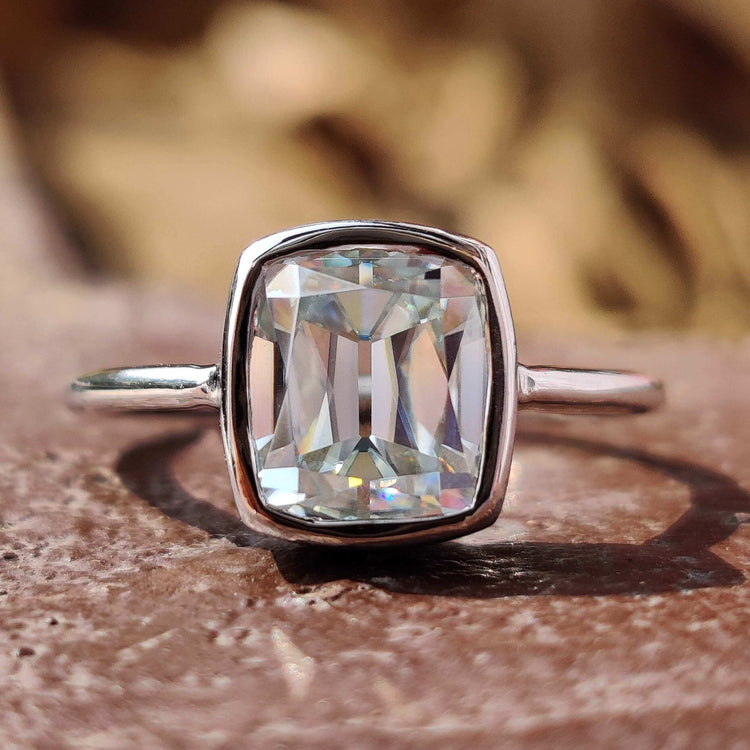 Cushion old European cut moissanite ring in white gold.
