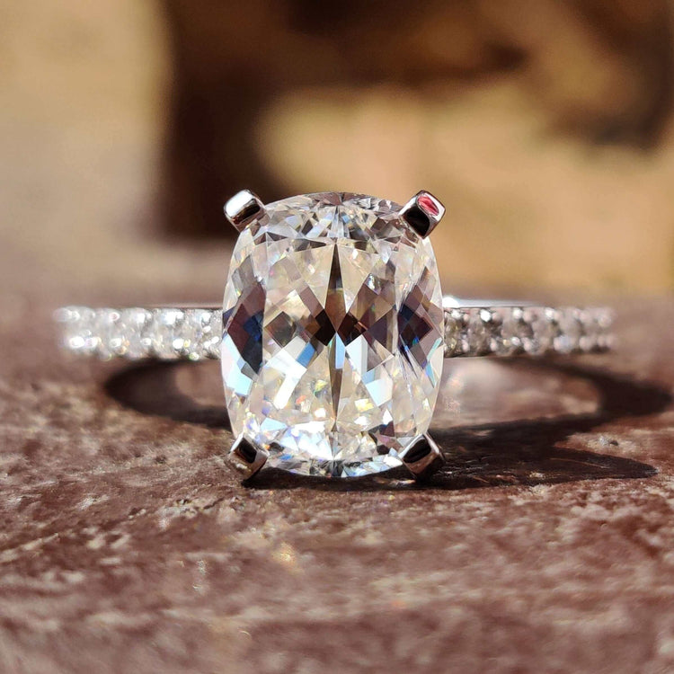 Cushion Divine engagement ring with round pave setting.
