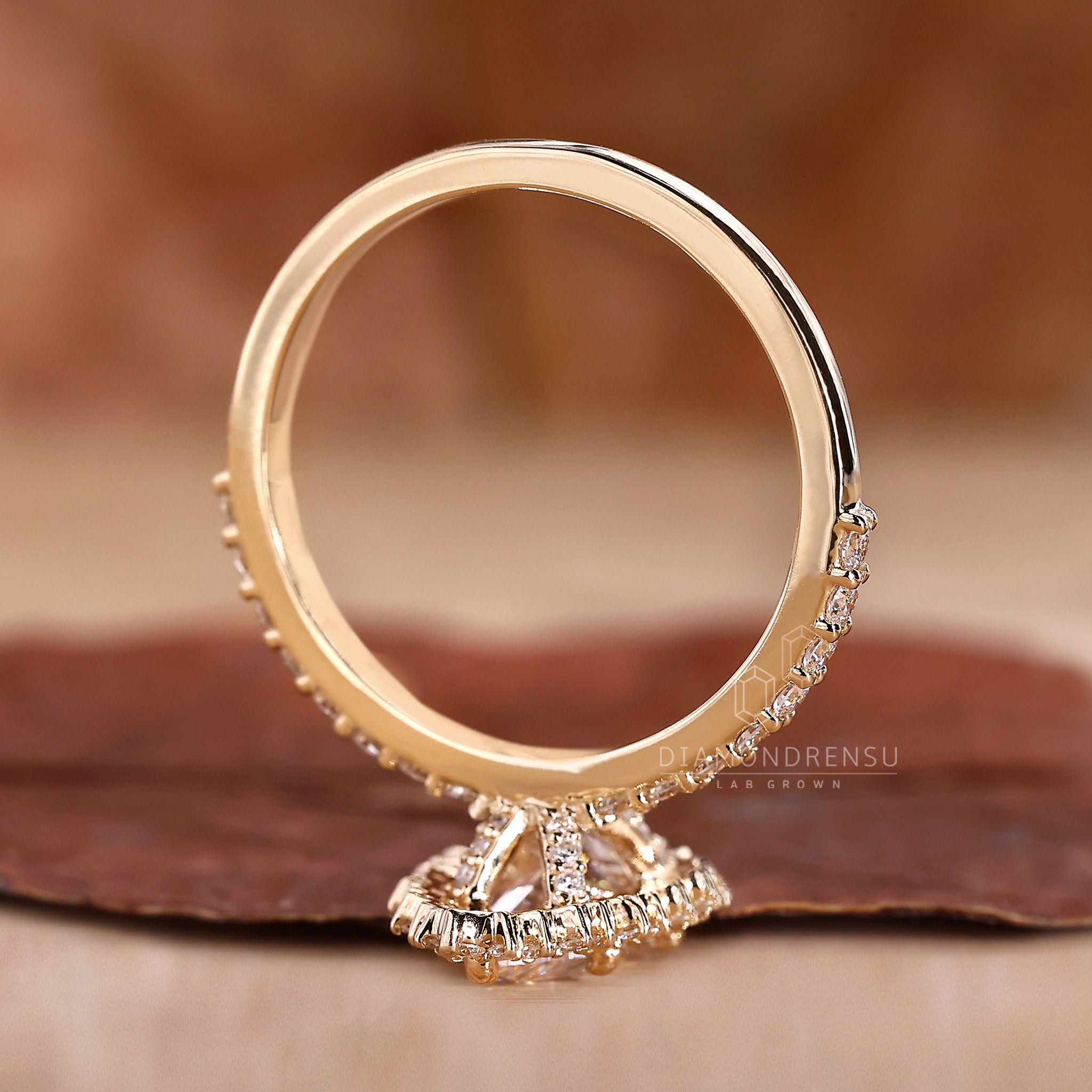 Handmade ring showcasing pave diamond design and round cut brilliance.
