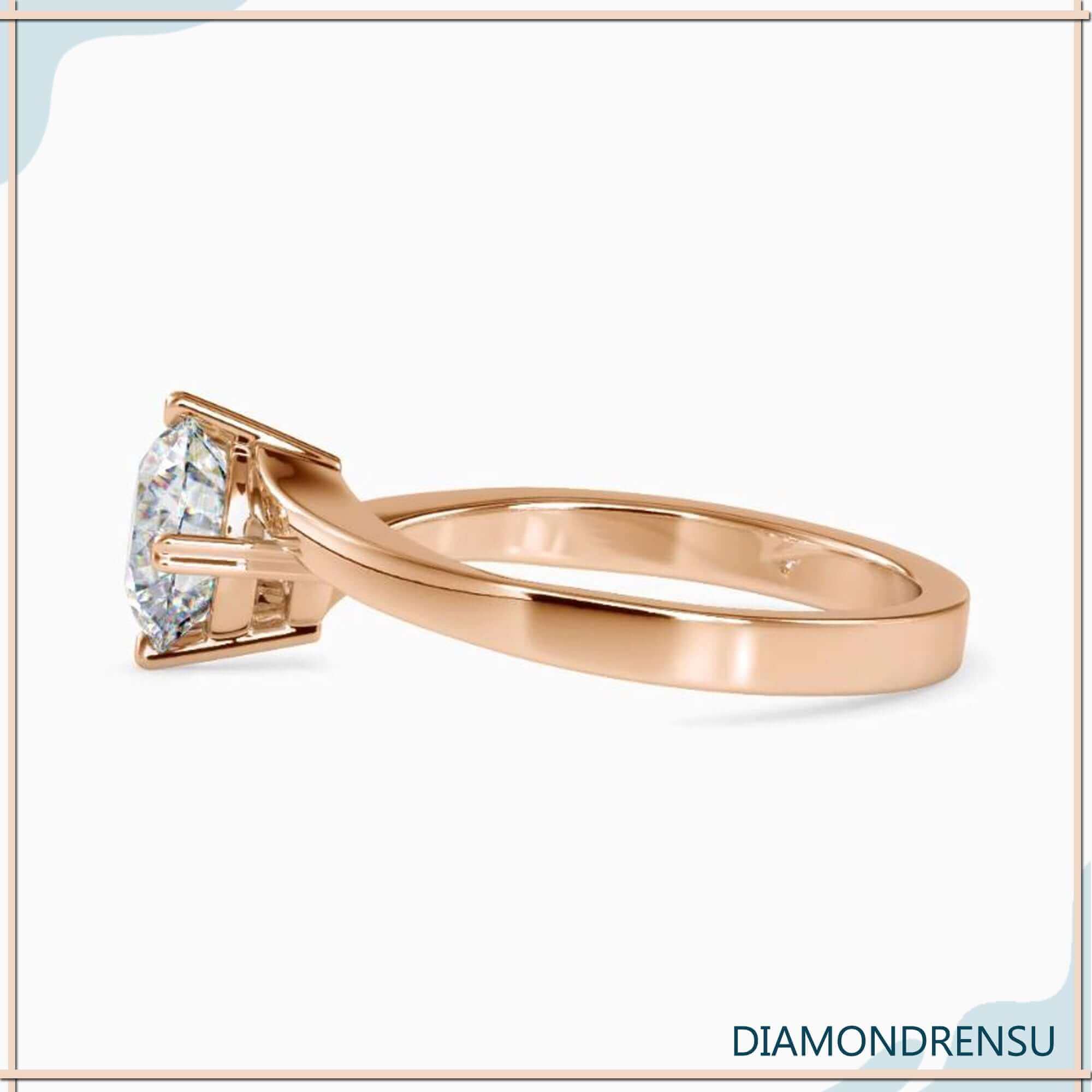 Round solitaire diamond ring with a bypass setting for timeless elegance.