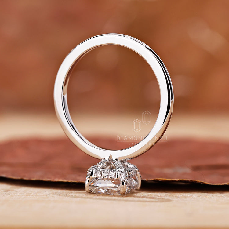 Handmade jewelry featuring a cushion cut diamond ring design.
