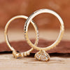 Chevron style wedding band with pear ring.
