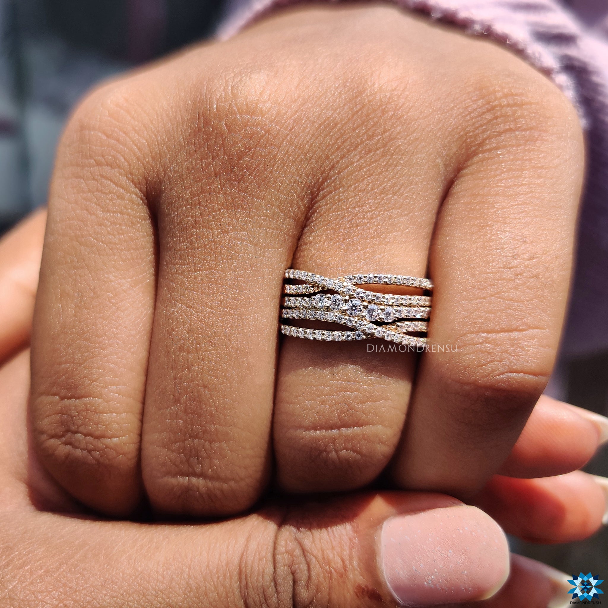Diamondrensu UK engagement ring with pave criss cross multi row design.
