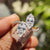 2 stone engagement ring with marquise cut moissanite and wave pave setting.

