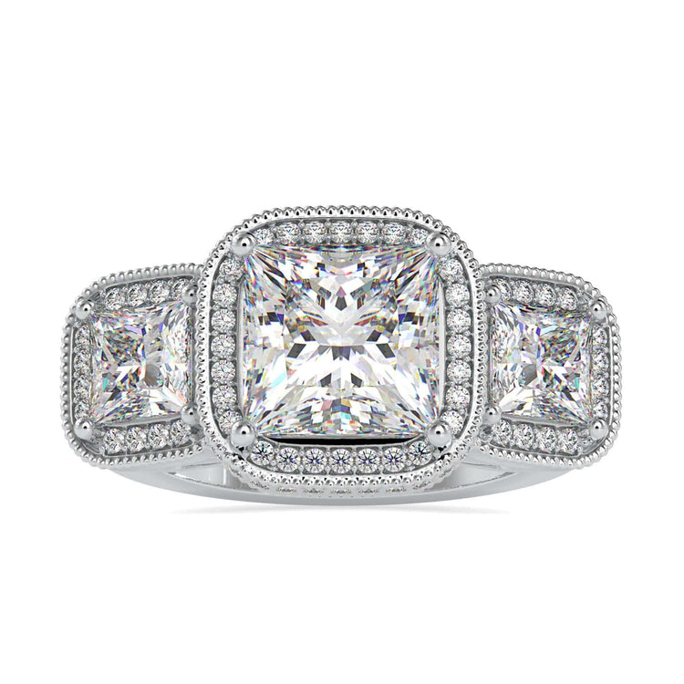 Three stone diamond ring with princess cut centre in white gold.
