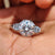 5 stone engagement ring with round moissanite centre and baguette side stones.
