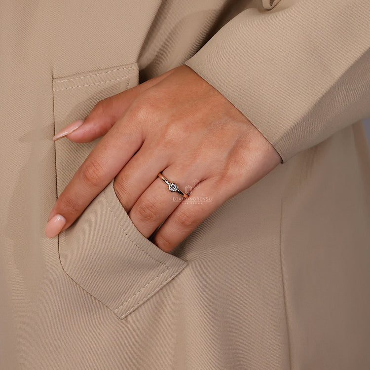 UK engagement ring with round cut diamond style.
