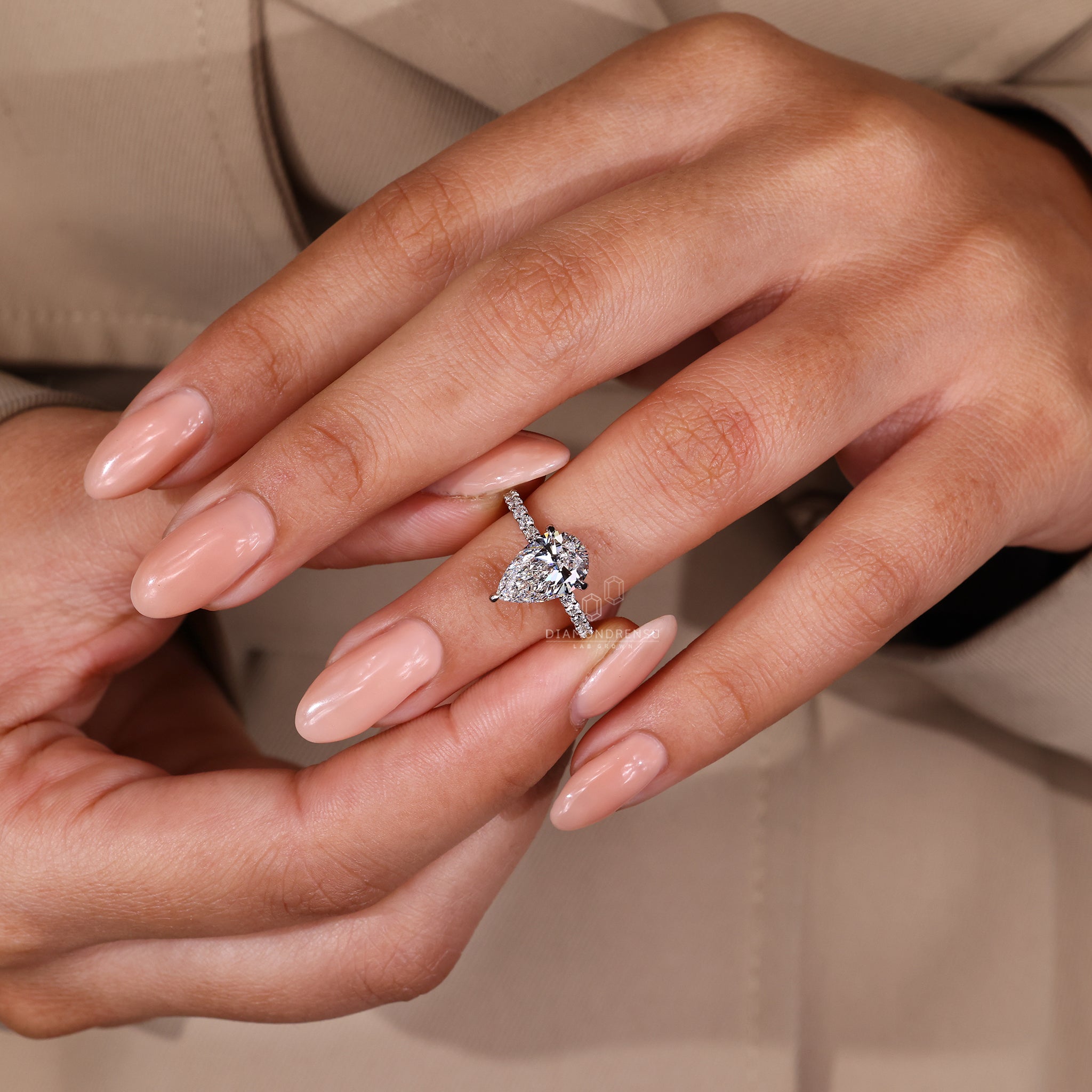 Pave diamond band in lab grown diamond engagement ring.
