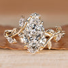 Pear cut diamond ring with marquise side stones.