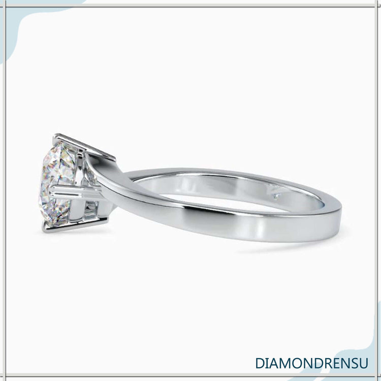 Designer solitaire ring with round cut diamond, IGI certified.
