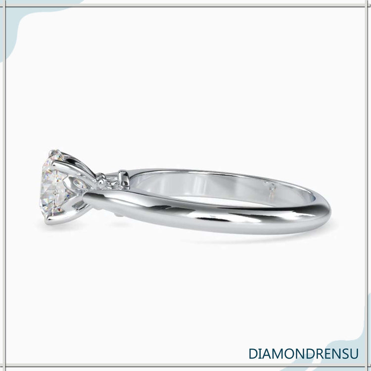 Rose gold diamond ring with round cut solitaire, IGI certified.
