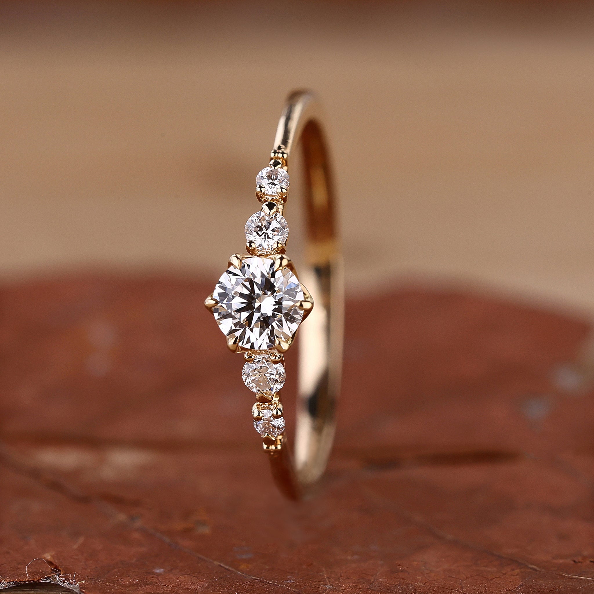 5 stone engagement ring in yellow gold.
