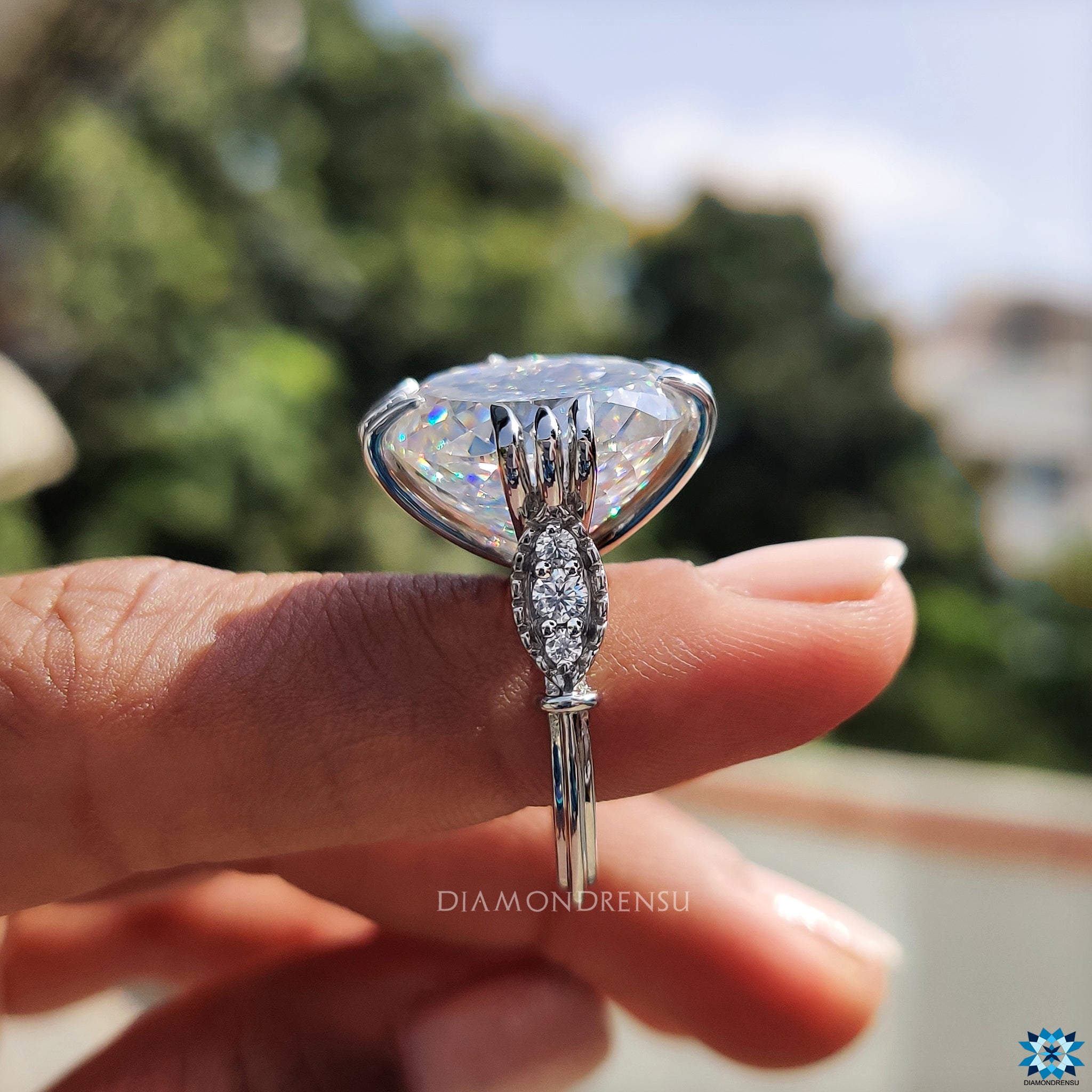 Moissanite ring UK with handcrafted milgrain edges and round cut sides.
