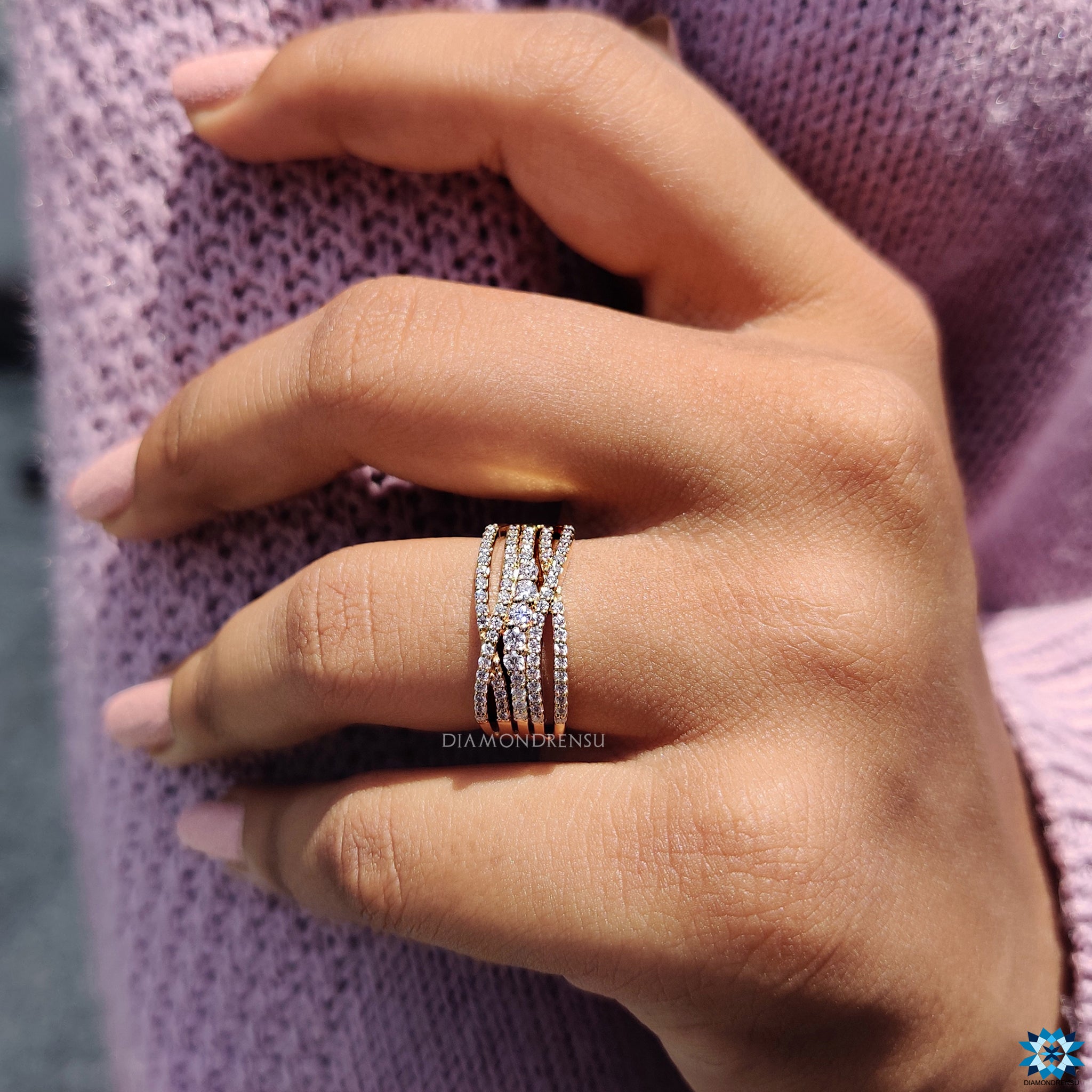 Multi row pave band with round moissanite and prong setting.
