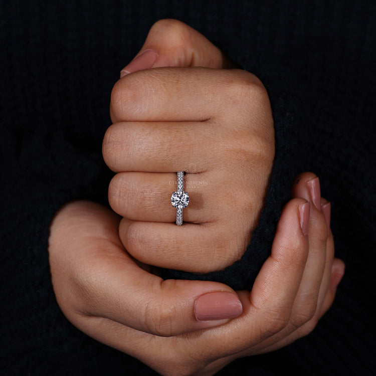 Engagement ring hidden halo crafted with pave diamonds and handmade jewellery for a one-of-a-kind design.
