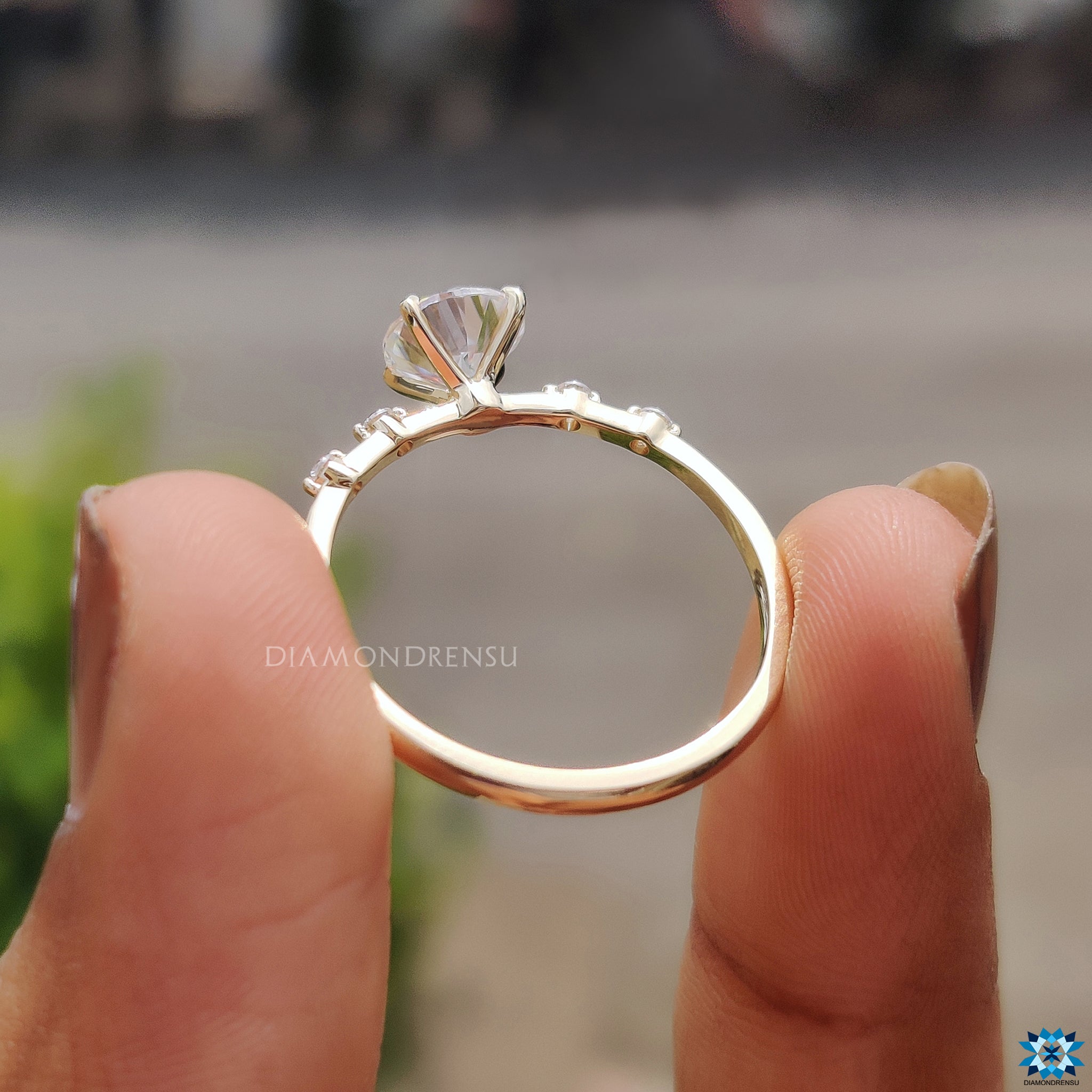 UK engagement ring with 1 carat moissanite and distance pave detailing.
